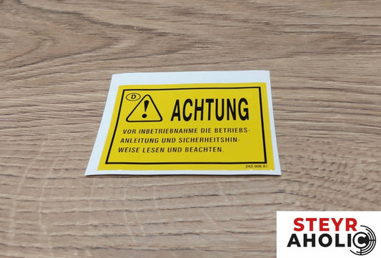 Aufkleber "Achtung vor Inbetriebnahme..."